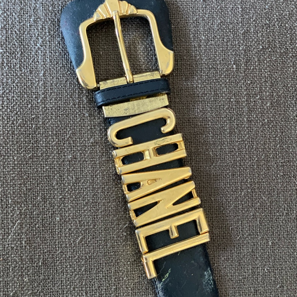 Vintage 90’s belt. Black leather. Spells CHANEL. Currently fits waist 29-39 inch